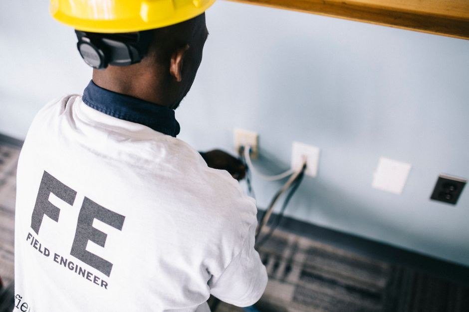 Qualified technician wiring a domestic distribution board on site